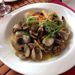 Garden vegetables and clama in the shell steamed in sauvignon blank