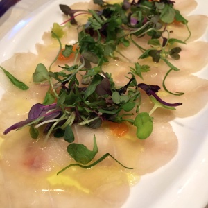 Tiradito De Corvina Al Aceite De Trufas Con Ensalada De Microgreens