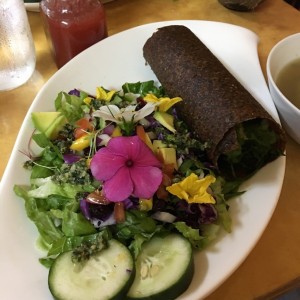 Raw burrito + edible flowers Salad 