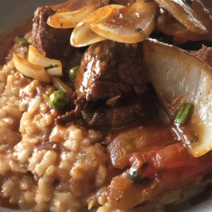 Lomo salteado con risotto