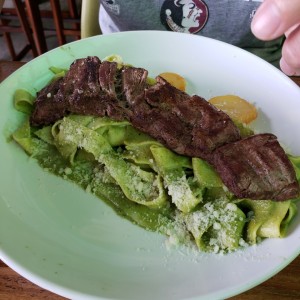 green spaghetti with steak