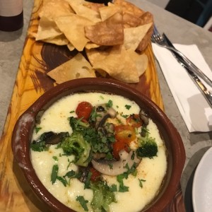 Queso fundido y hongos