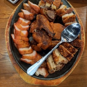 costillas, puerco y pato asado 