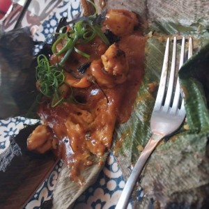 Tamal de arroz con langosta