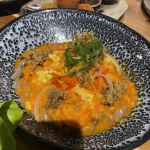 Guacho con guandú, coco y mariscos
